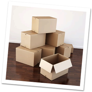 Stack of empty boxes on a hardwood floor