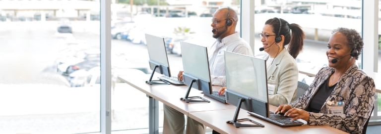 U-Haul® Corporate Account Specialists on their computers