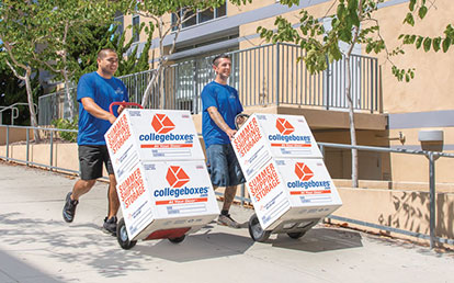 Moving helpers using dollies to move boxes