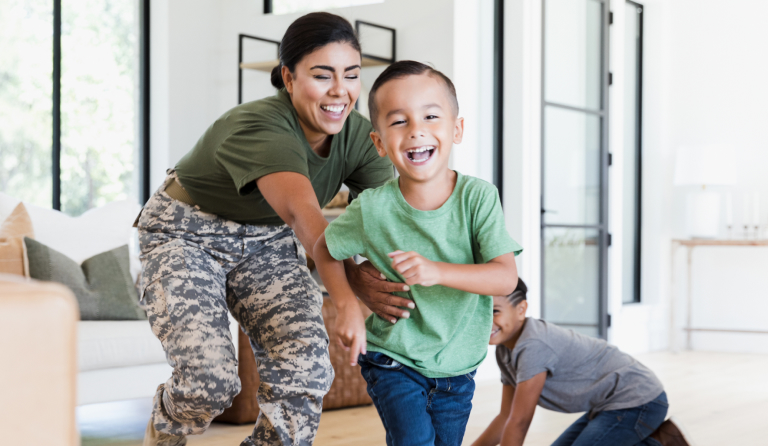 Military family playing in a living room
