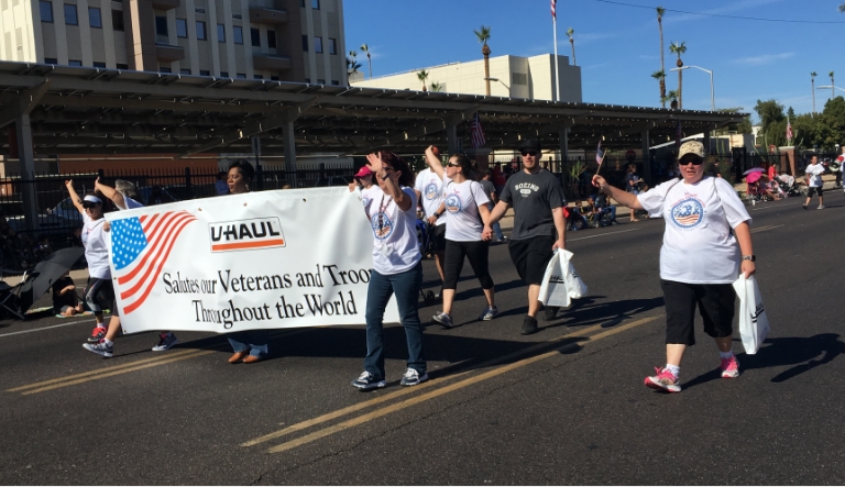A U-Haul Team Members marching in the 2017 Phoenix Veterans Day Parade