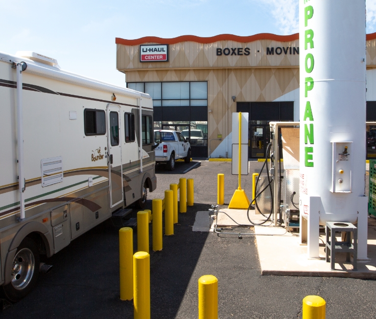 An RV (Recreational Vehicle) is parked at a U-Haul Propane refill station