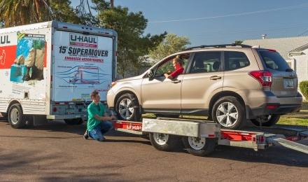 A car on a transport trailer