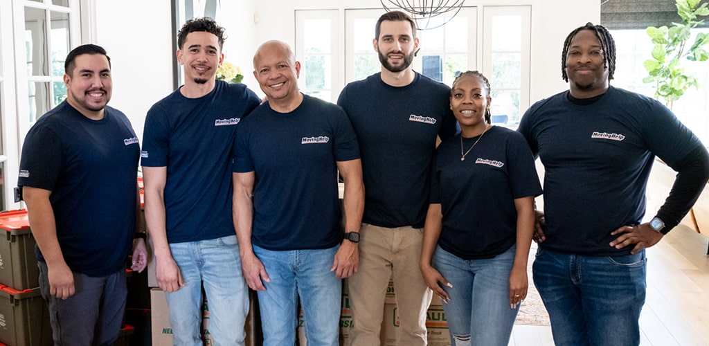 Moving Help® Service Provider group pose inside a family home