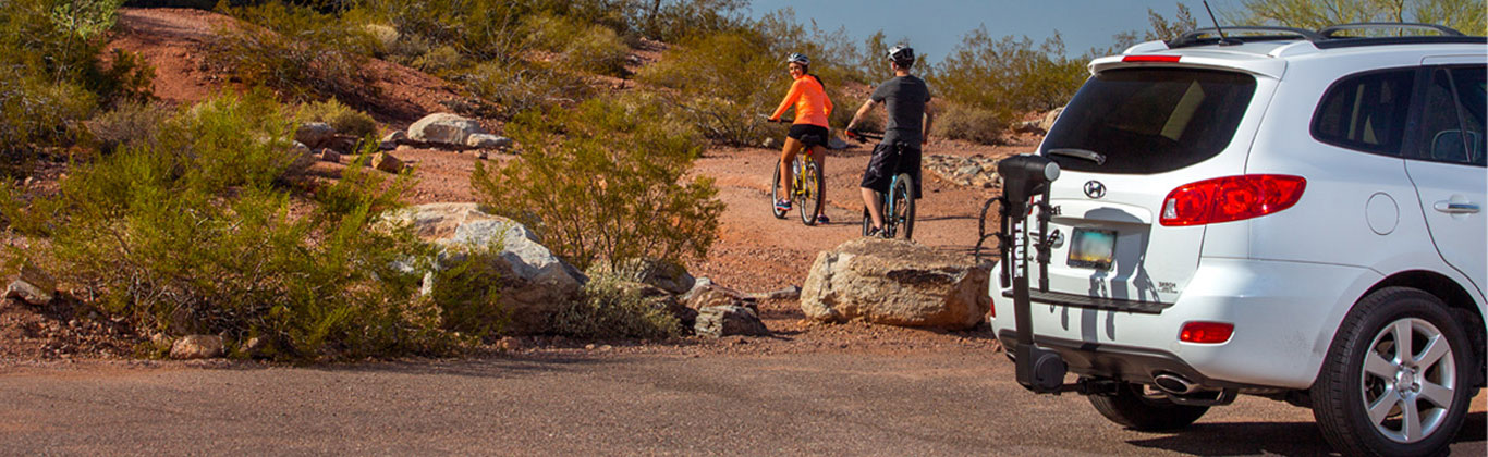 A couple riding mountain bikes on a trail