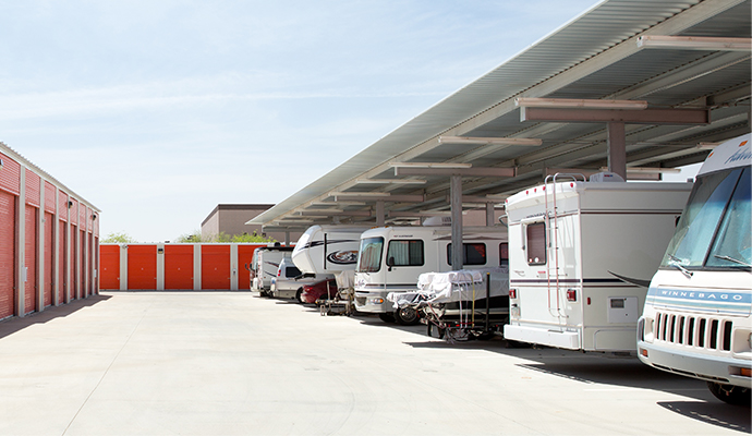 RV's, cars, trailers under a covered parking structure