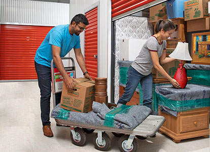 A couple moving into a storage unit