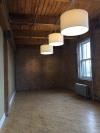 Brick, hardwood floors and timber enrich this space.